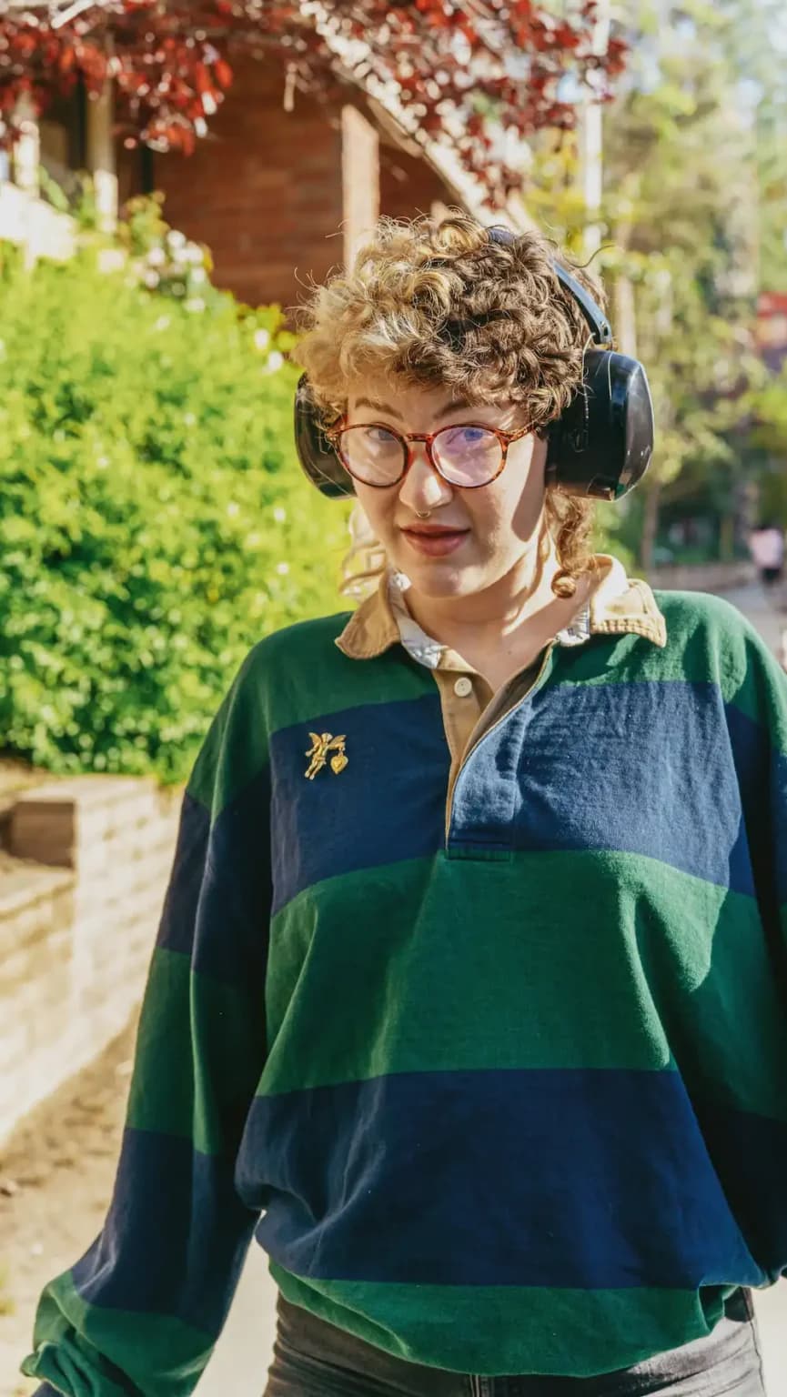 Person with headphones in soft daylight