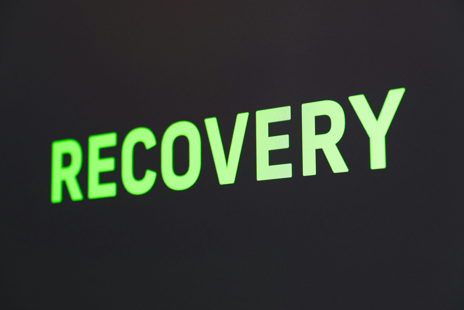 the word recovery written in green