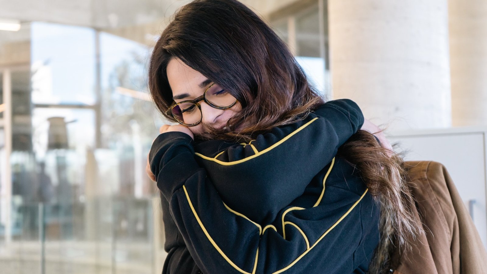 woman hugging herself